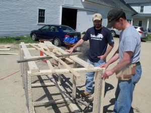 Timberland employees help build our compost units.