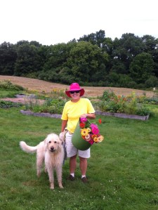 Gardener with dog and flowers